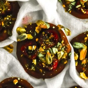 close-up-cherry-pistachio-chocolate-bite-showing-fresh-cherry-and-pistachios