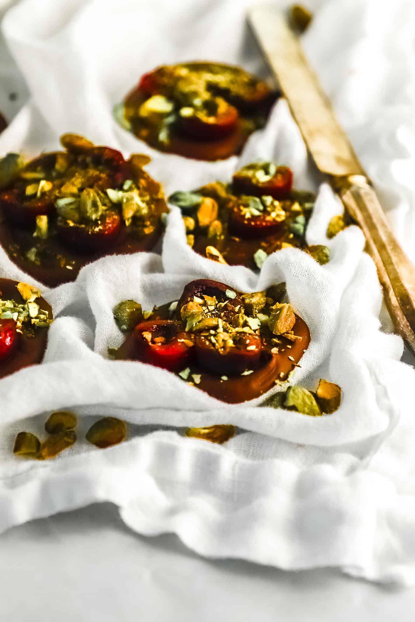 single-cherry-pistachio-chocolate-bite-with-sea-salt-flakes