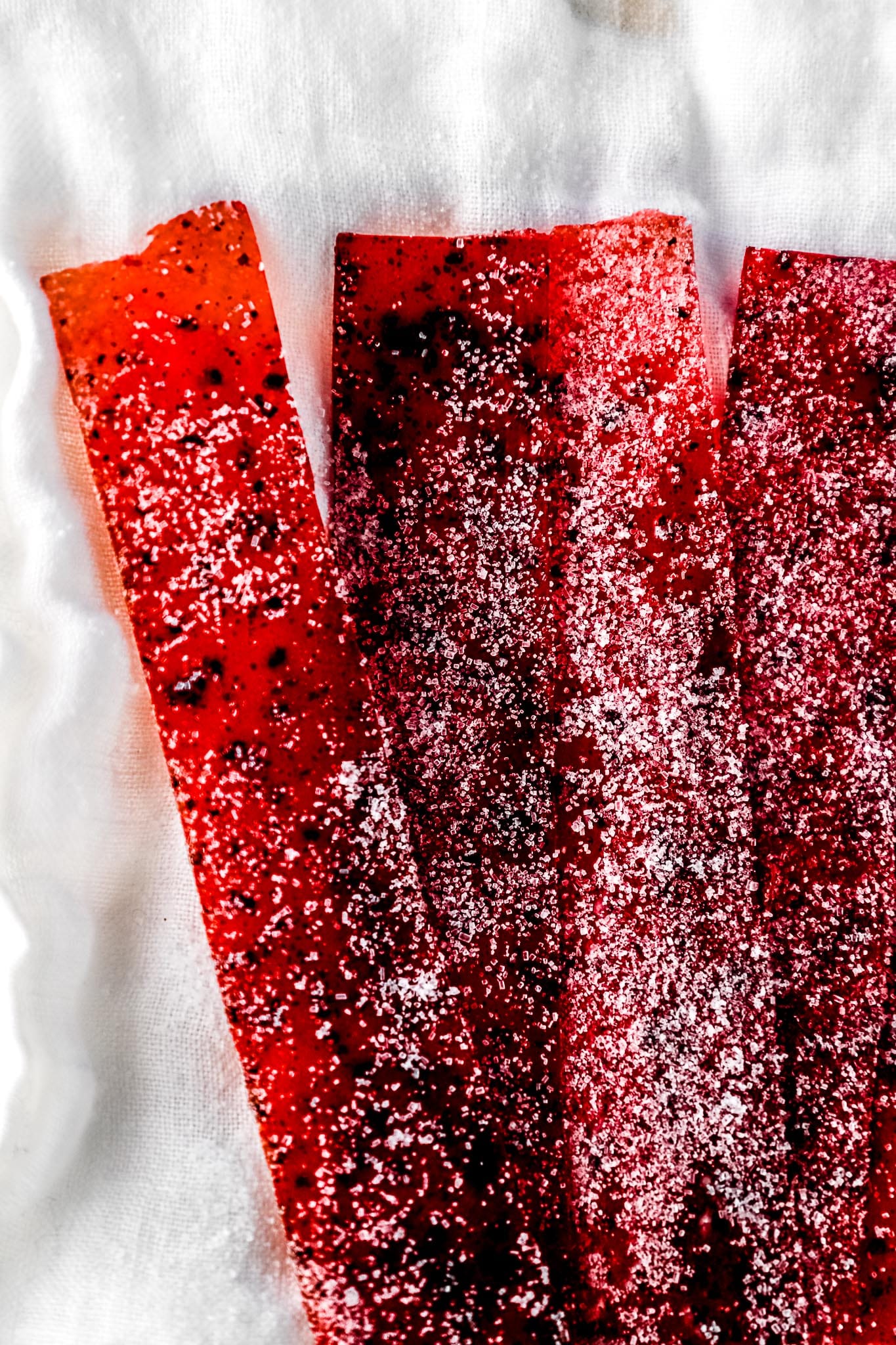 colorful-pink-orange-fruit-leather-rolls-stacked-together