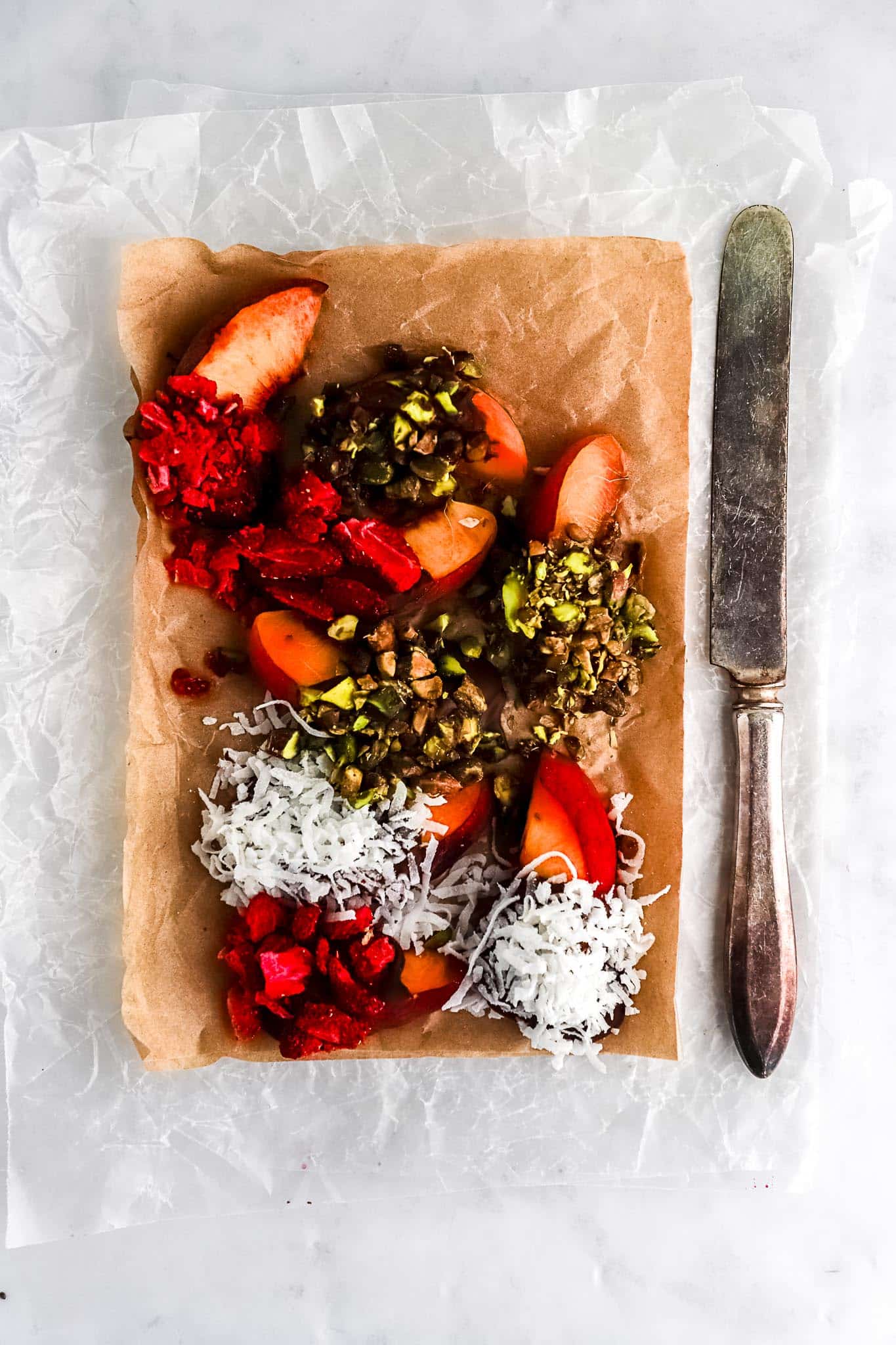 elegant-chocolate-dipped-peaches-three-toppings-parchment-paper