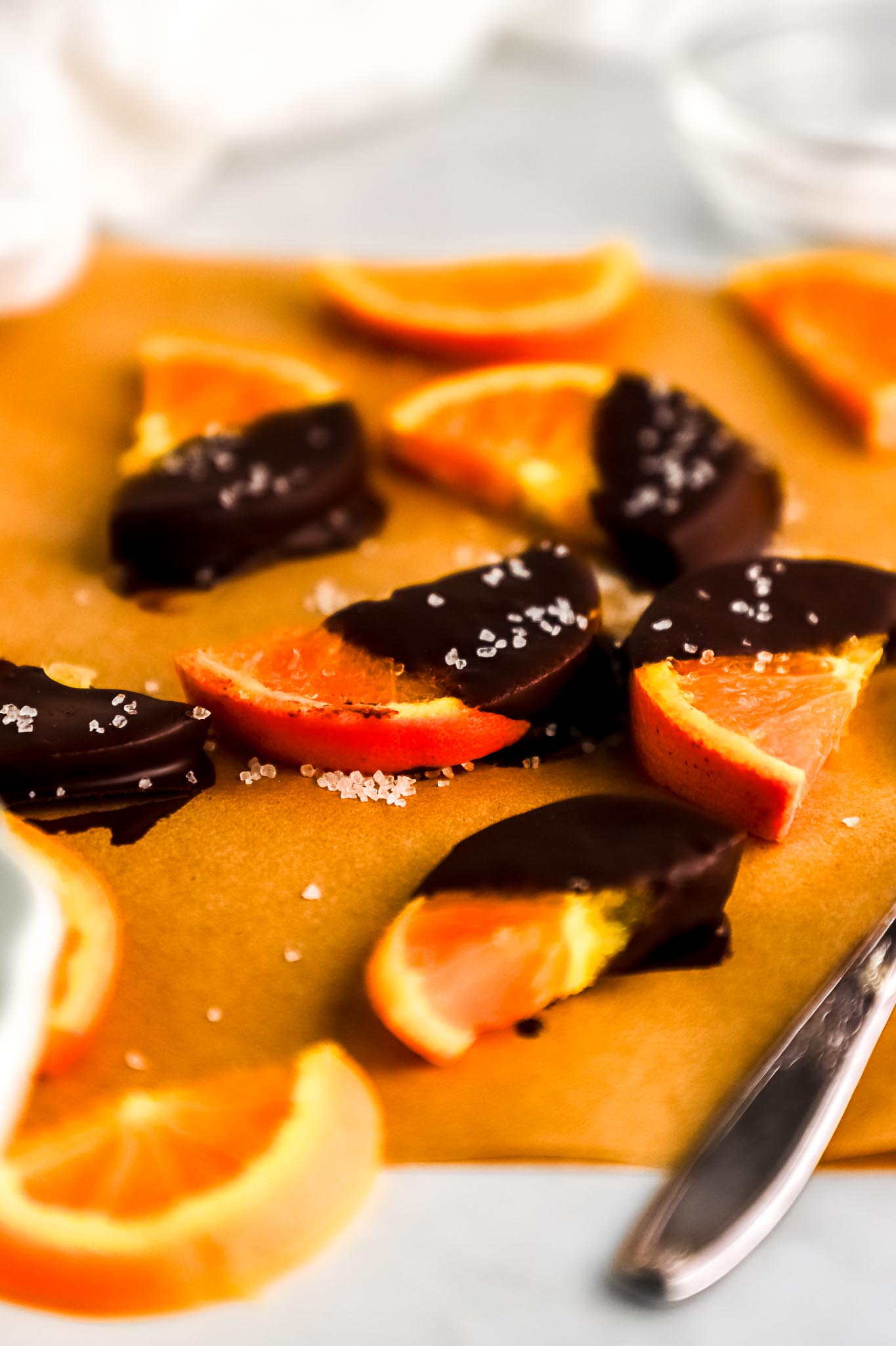 chocolate-dipped-orange-segments-on-parchment-paper