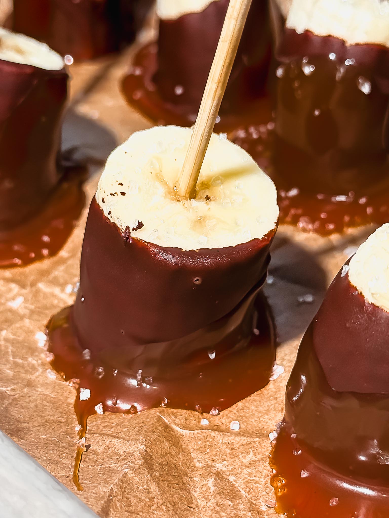 chocolate-caramel-banana-bites-on-parchment-paper-gluten-free-dessert
